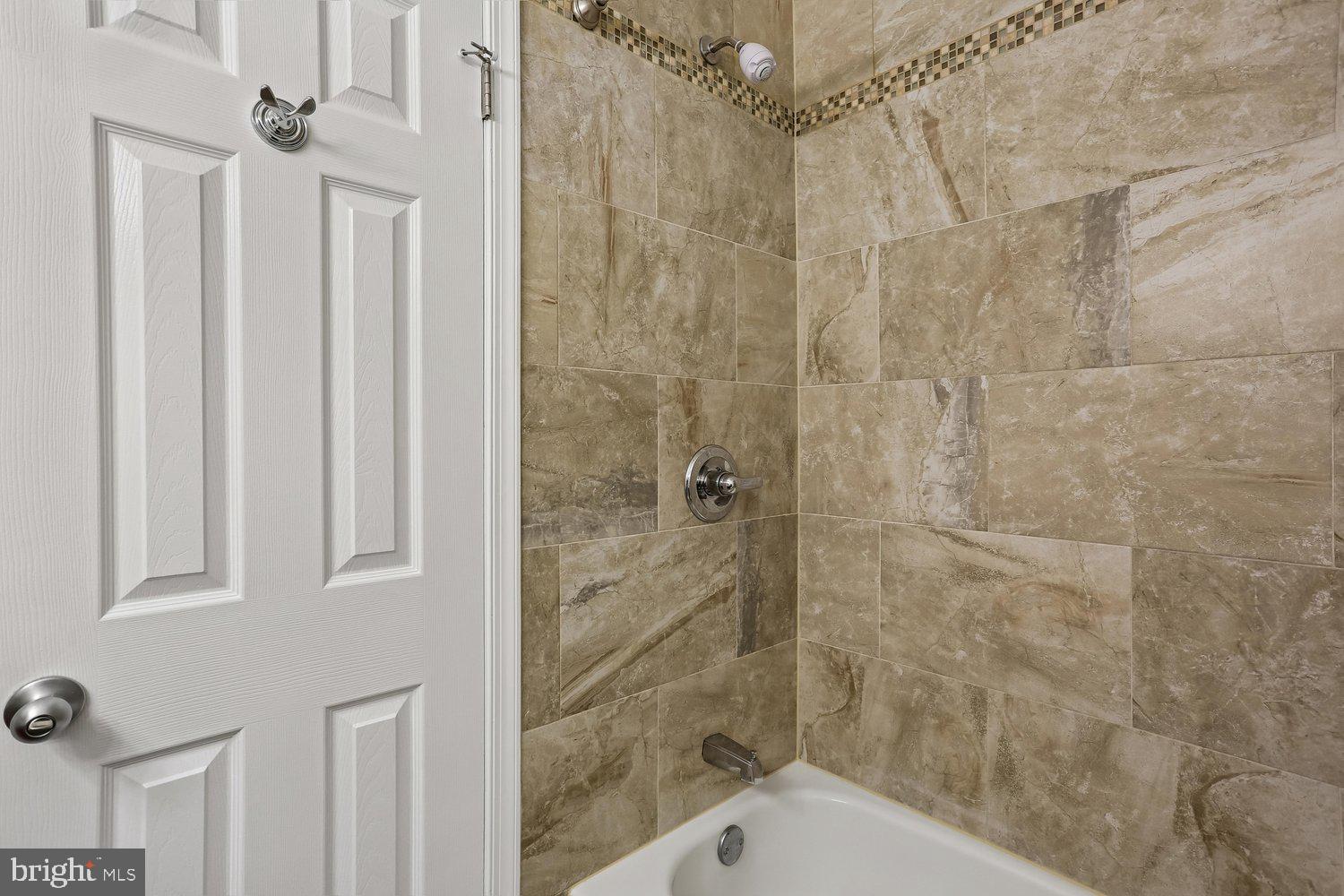 10804 Douglas Avenue Silver Spring, MD 20902 - Photo 33 of 46 Updated hall bath with tub/shower