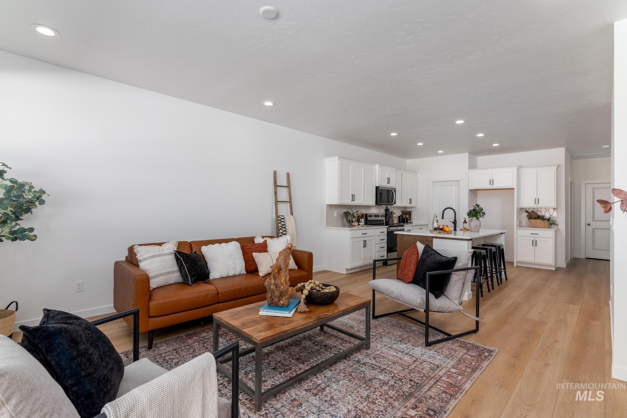 8521 West Stillmore Street Star, ID 83669 - Photo 2 of 7 Living room with recessed lighting and light wood finished floors
