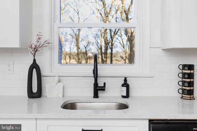 a view of a dining room with furniture wooden floor and chandelier