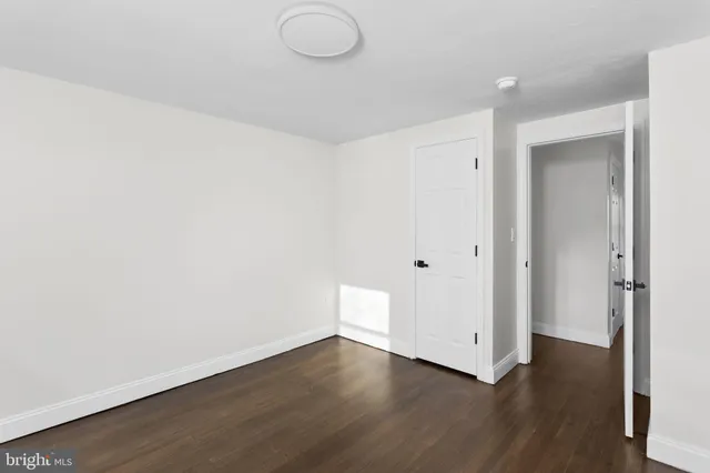 a white bath tub sitting next to a white toilet