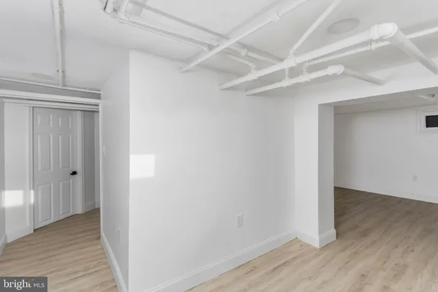 a white toilet sitting next to a white sink
