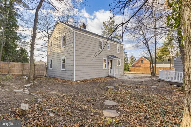 a view of a yard with a house and a tree