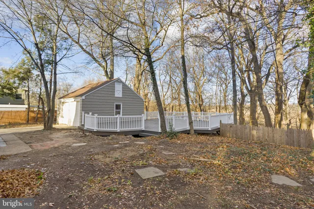 a view of a house with a wooden deck