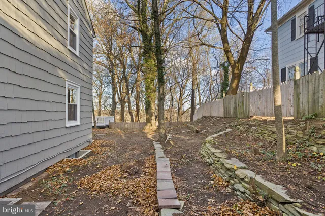 a backyard of a house with lots of green space