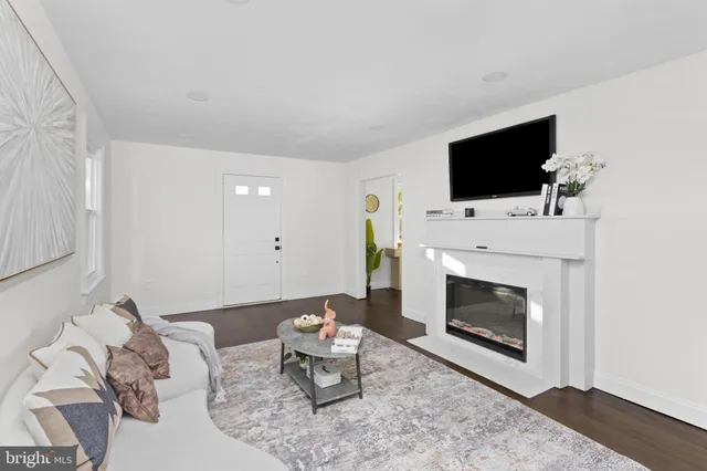a view of a dining room with furniture wooden floor and a chandelier