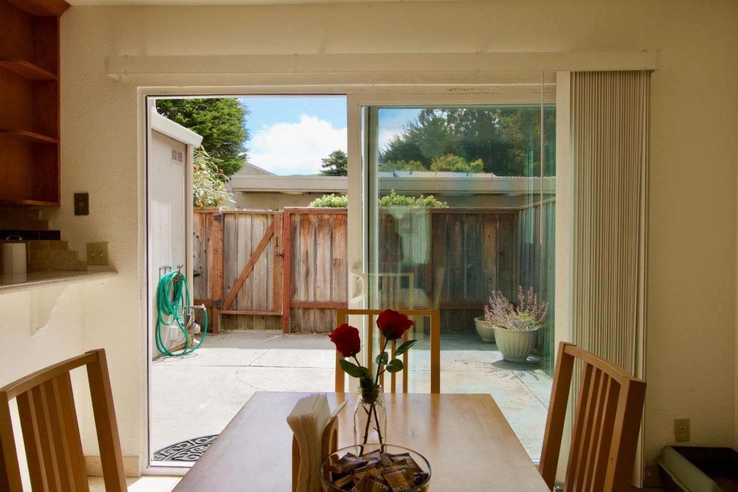 1265 Rosita Road Pacifica, CA 94044 - Photo 6 of 15 a dining room with furniture and a floor to ceiling window