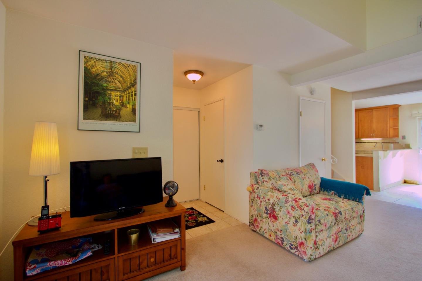 1265 Rosita Road Pacifica, CA 94044 - Photo 8 of 15 a living room with furniture and a flat screen tv