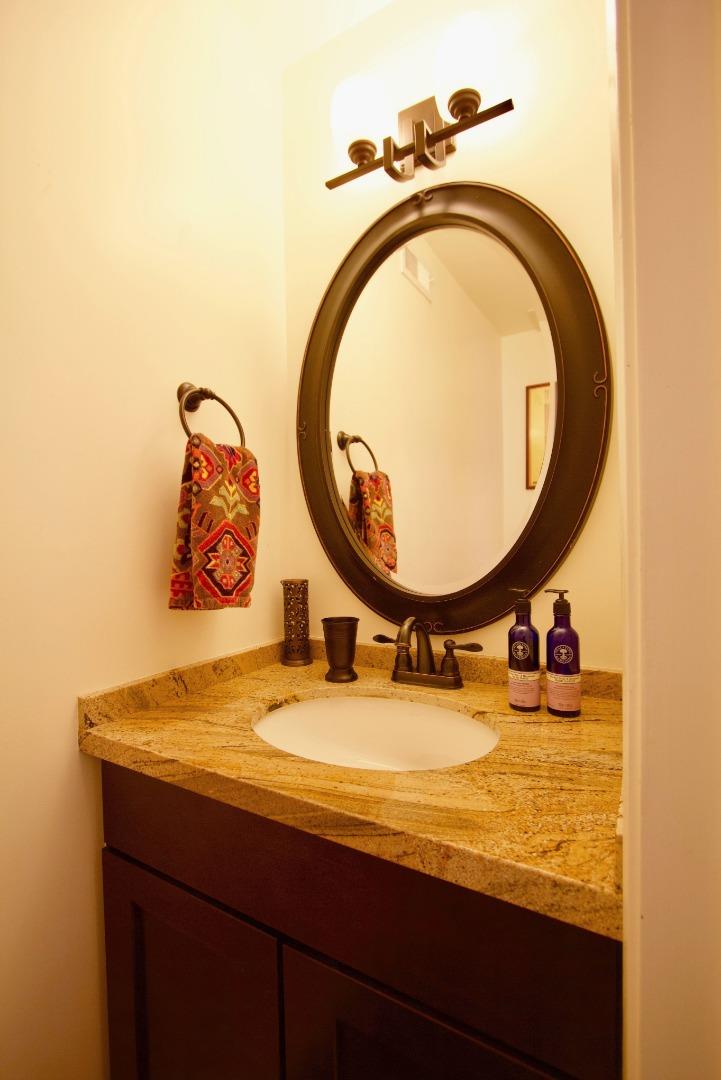1265 Rosita Road Pacifica, CA 94044 - Photo 10 of 15 a bathroom with a sink and a mirror