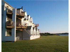 1215 Windward Road, Unit 1215 Milford, CT 06461 - Photo 1 of 1 a front view of a house with a ocean view