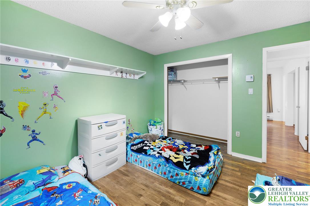 256 Sundance Road Effort, PA 18330 - Photo 42 of 83 a bedroom with baby bed toys and paintings on the wall