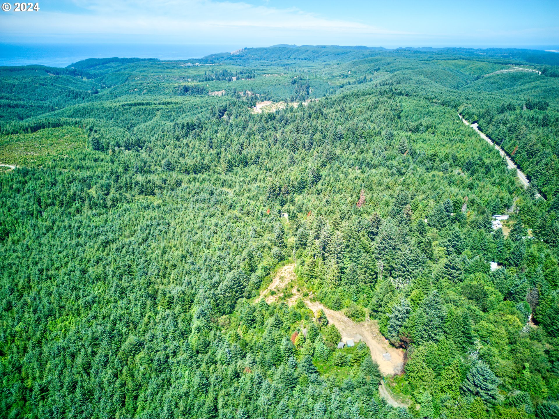 59430 West Beaver Hill Road Bandon, OR 97411 - Photo 14 of 14 a view of a lush green space with sea