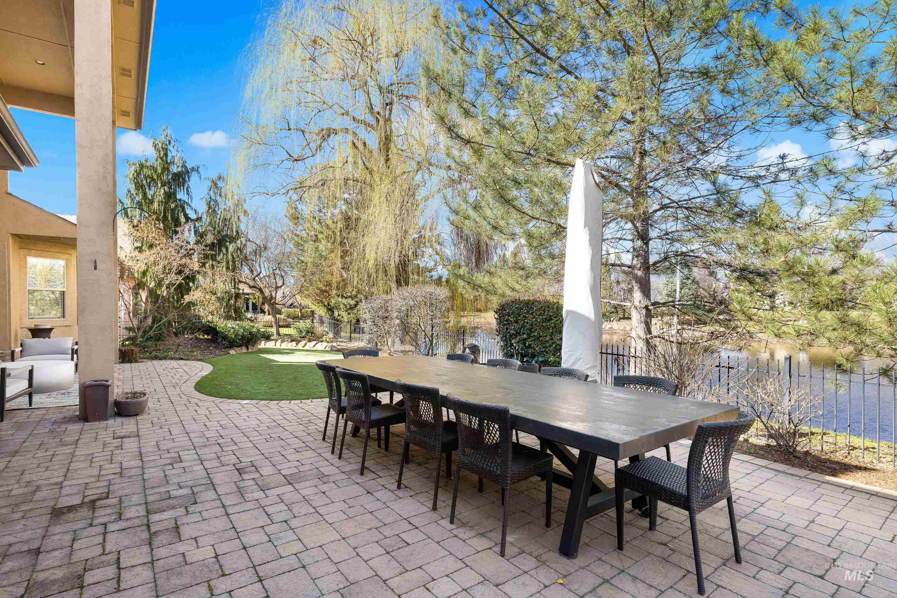 1166 East Rivers End Drive Eagle, ID 83616 - Photo 43 of 50 Fenced backyard with a patio and outdoor dining area