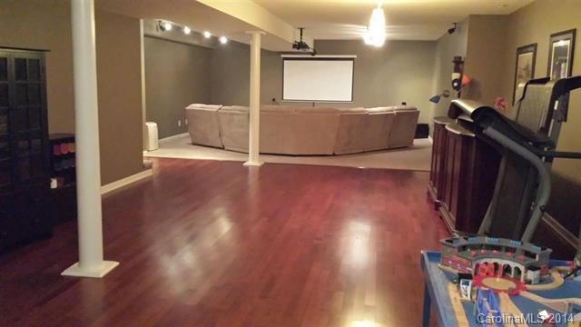 1425 Autumn Ridge Lane, Unit 442 Fort Mill, SC 29708 - Photo 22 of 24 a living room with hard wood floors and a wooden floor