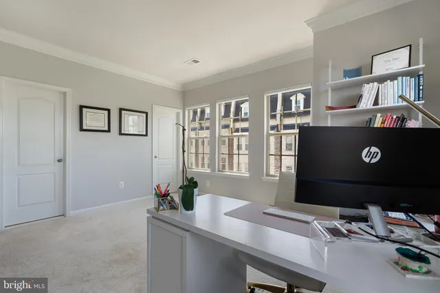 a view of a workspace with furniture
