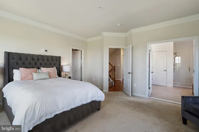 a spacious bathroom with a granite countertop sink a toilet and shower