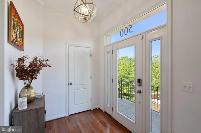 a view of an entryway with wooden floor