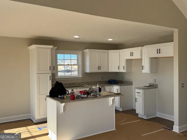a kitchen with cabinets and appliances