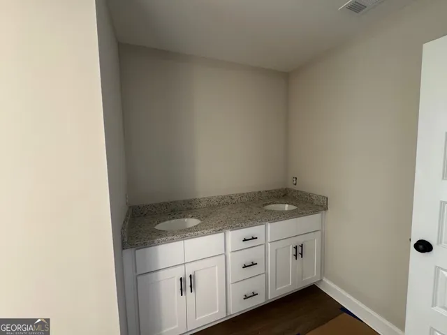 a utility room with cabinets