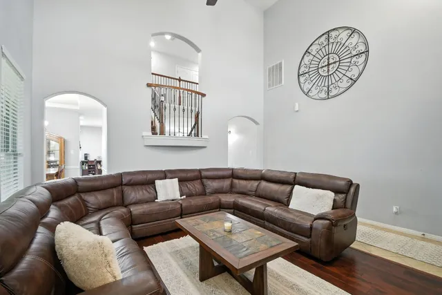 a living room with furniture and a table