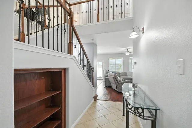 a view of a livingroom with furniture and staircase