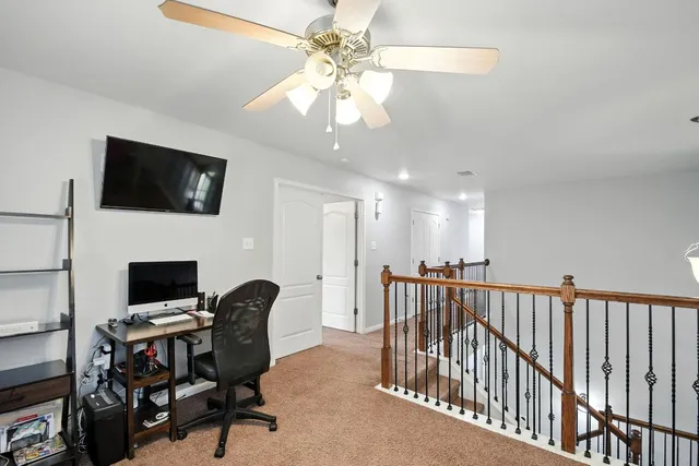 a view of a livingroom with a workspace
