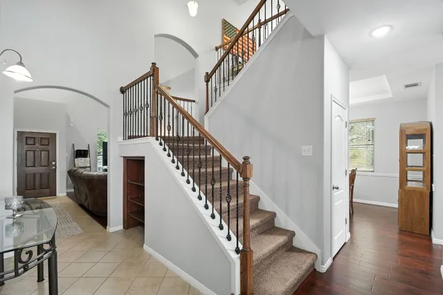 a view of entryway and hall with wooden floor