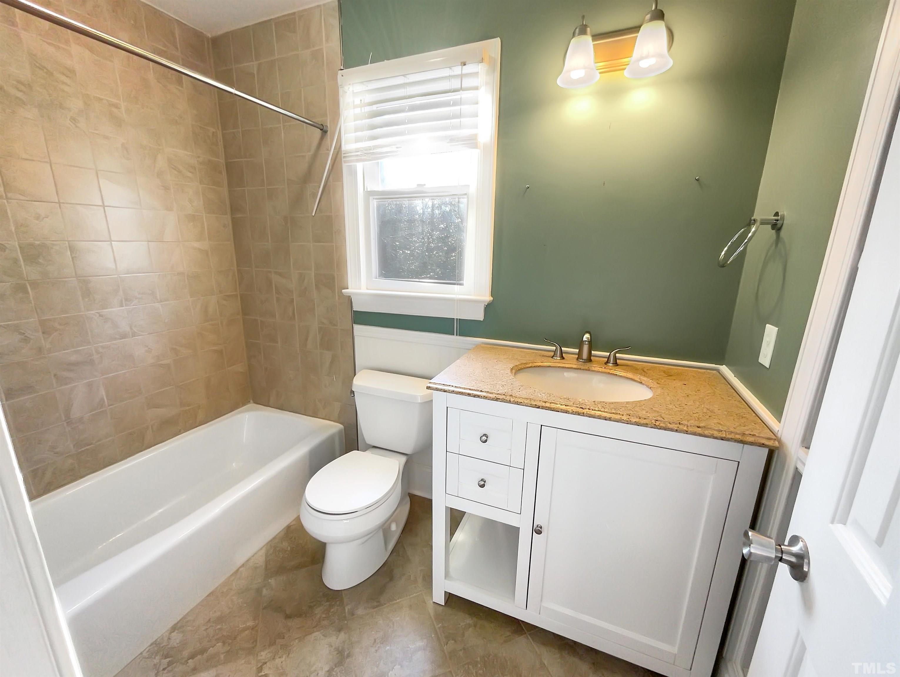 500 Chapwith Road Garner, NC 27529 - Photo 11 of 17 a bathroom with a sink a toilet and a bathtub