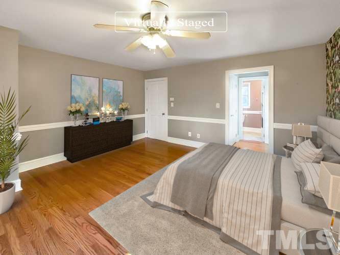 500 Chapwith Road Garner, NC 27529 - Photo 16 of 17 a bedroom with a bed and dresser with mirror