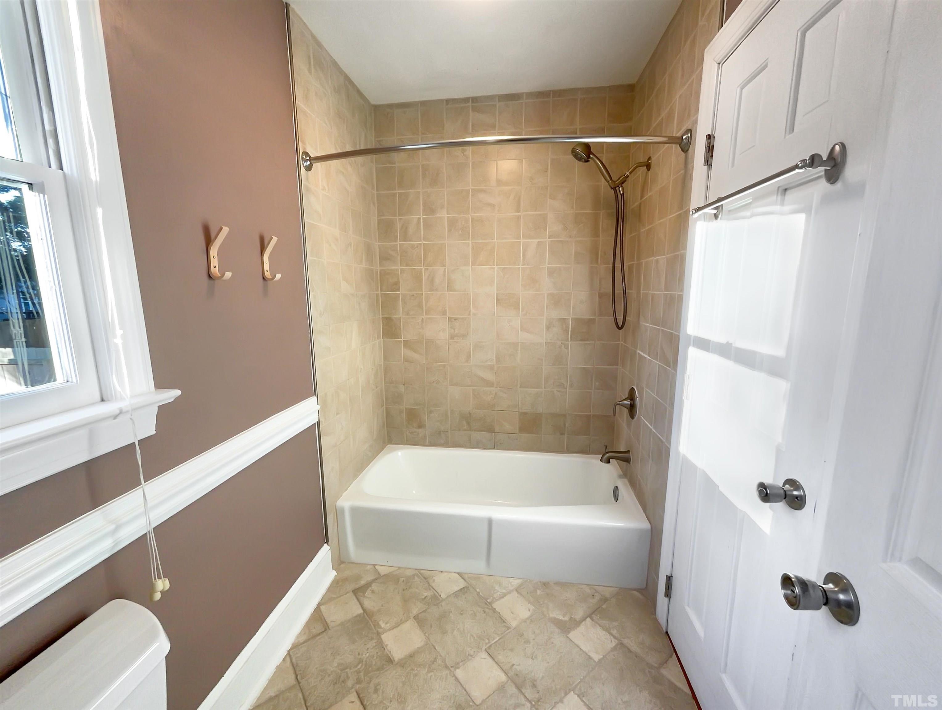 500 Chapwith Road Garner, NC 27529 - Photo 8 of 17 a bathroom with a bathtub and a shower