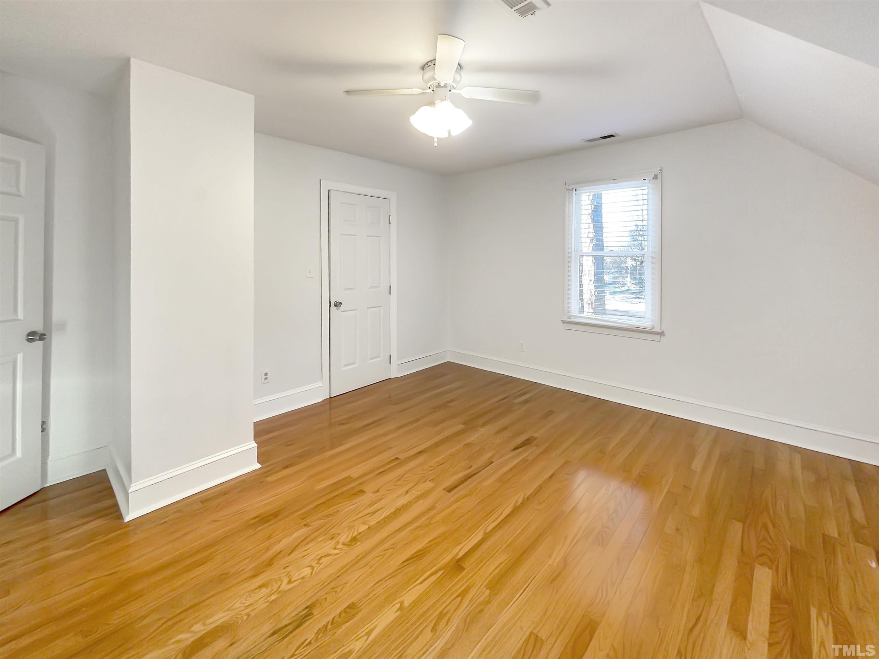 500 Chapwith Road Garner, NC 27529 - Photo 10 of 17 a view of empty room with wooden floor and fan