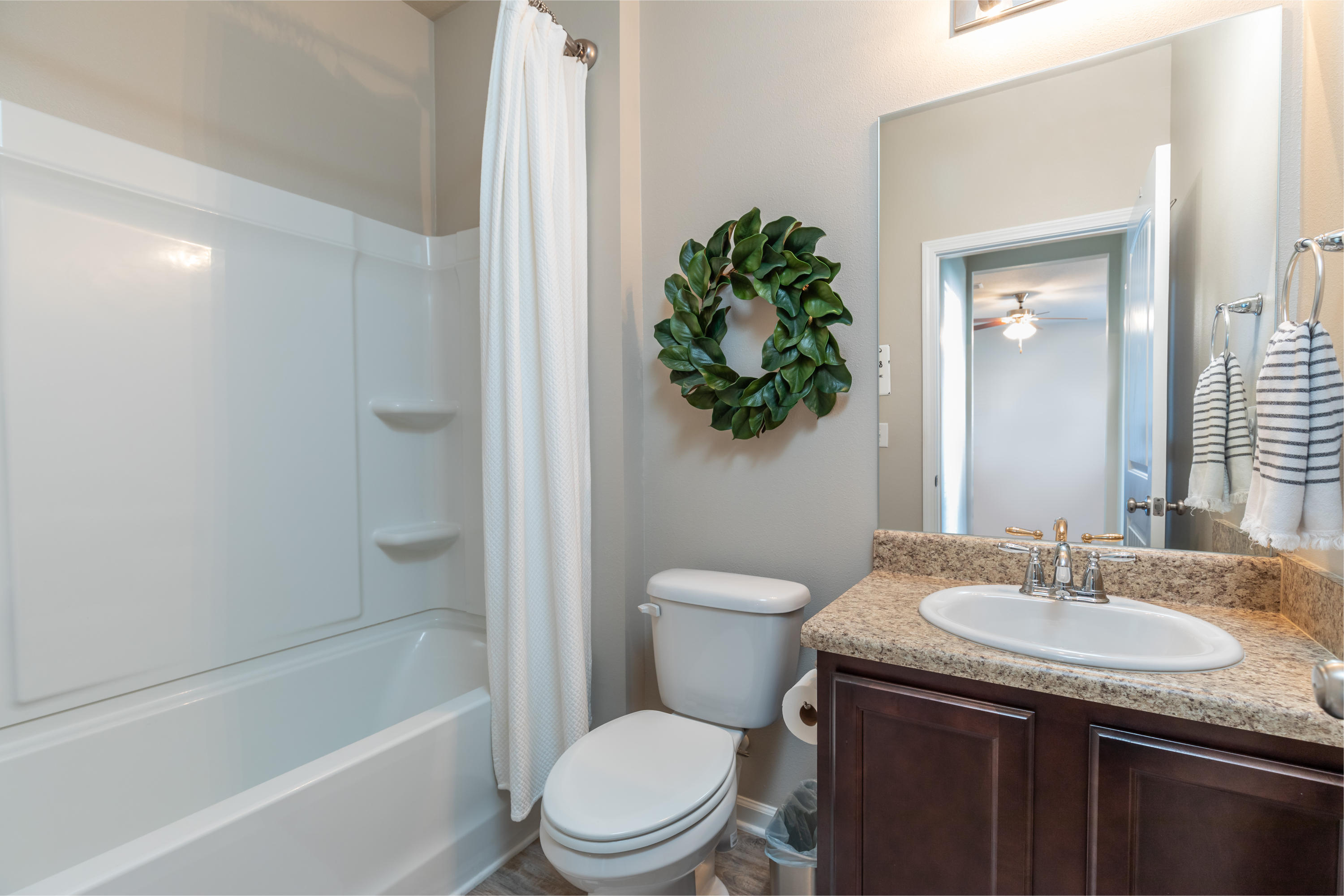 321 Fanny Ann Way Freeport, FL 32439 - Photo 14 of 38 a bathroom with a granite countertop sink toilet and shower