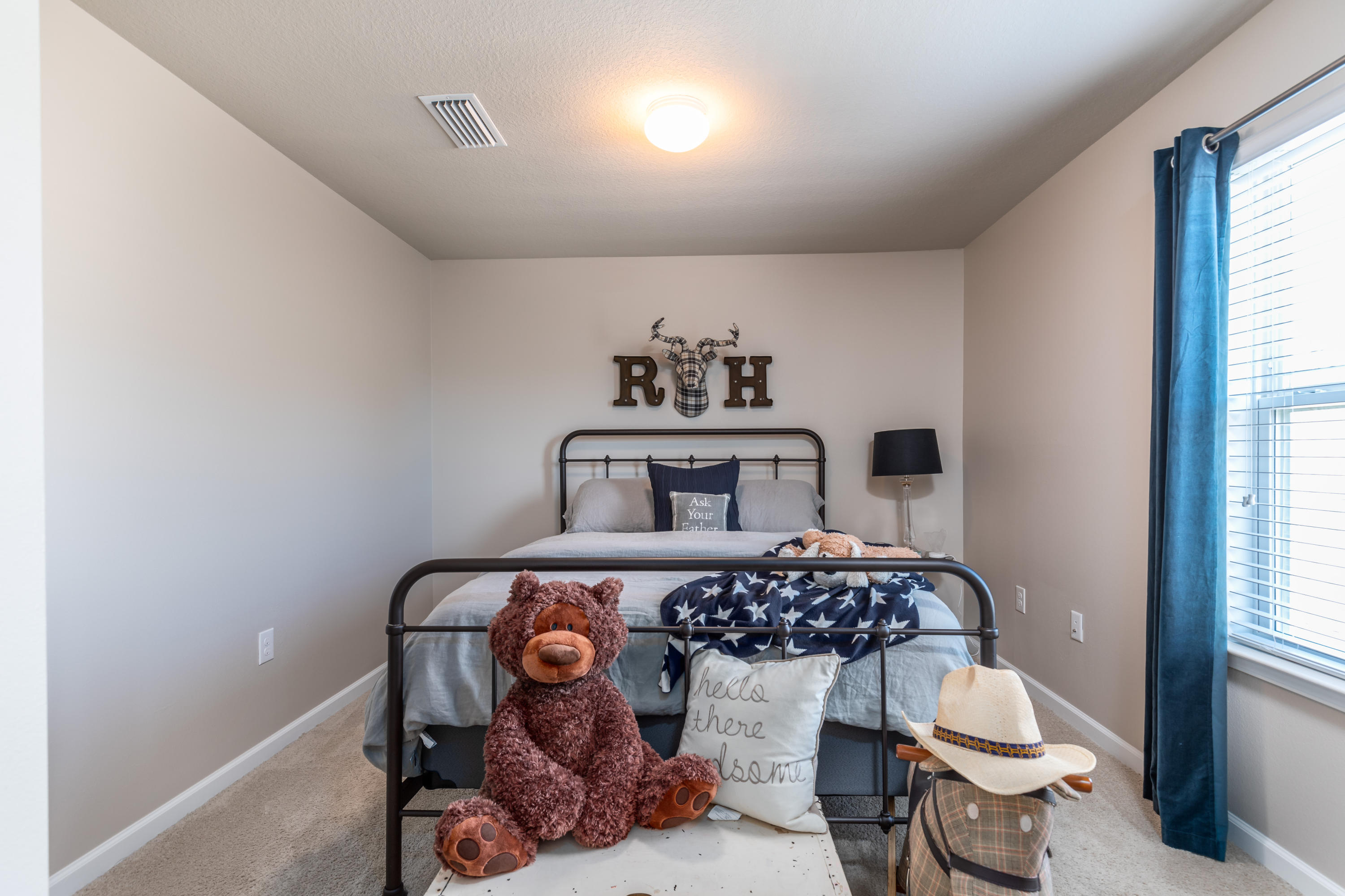 321 Fanny Ann Way Freeport, FL 32439 - Photo 15 of 38 a bedroom with a bed and a chandelier