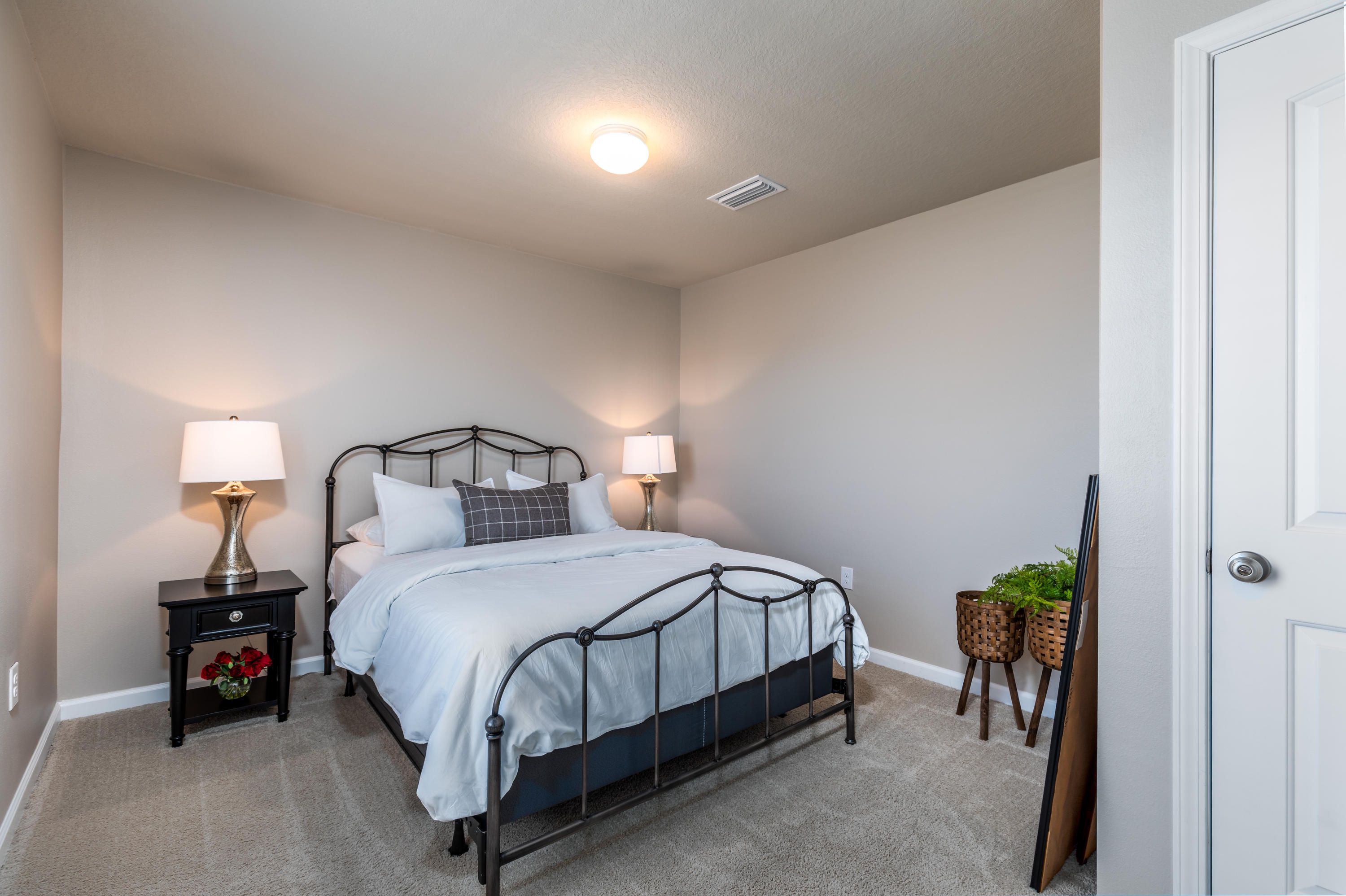 321 Fanny Ann Way Freeport, FL 32439 - Photo 17 of 38 a bedroom with a bed and a lamp