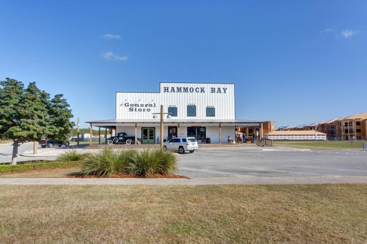 321 Fanny Ann Way Freeport, FL 32439 - Photo 35 of 38 a view of a street with a building and trees in the background