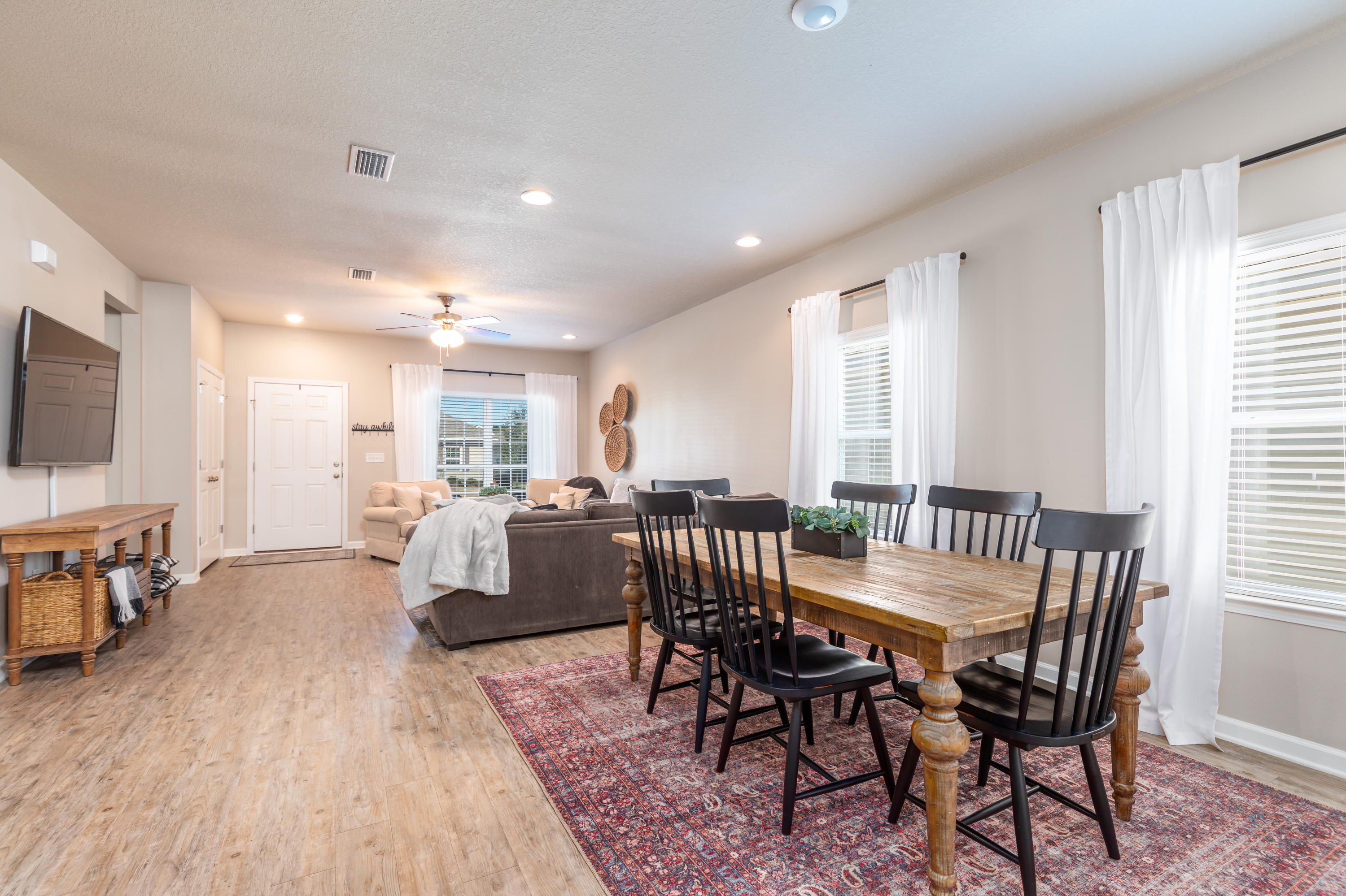 321 Fanny Ann Way Freeport, FL 32439 - Photo 5 of 38 a view of a dining room with furniture and wooden floor