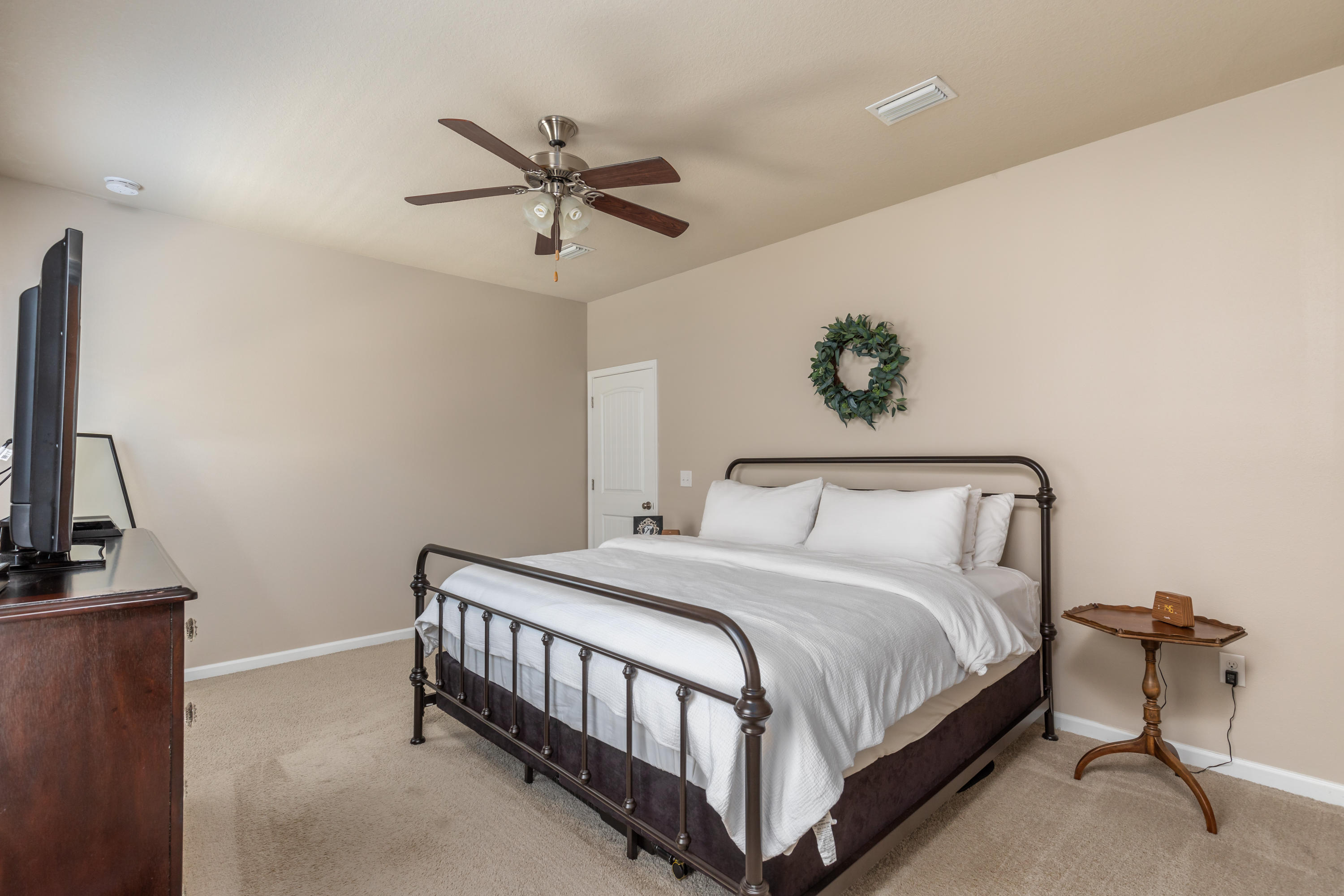 321 Fanny Ann Way Freeport, FL 32439 - Photo 9 of 38 a bedroom with a bed and a chandelier