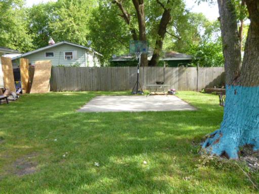 15423 Maple Lane Markham, IL 60428 - Photo 14 of 16 a view of a yard with a house and a large tree