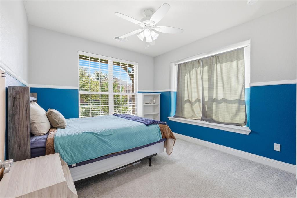 117 Birdcall Lane Argyle, TX 76226 - Photo 11 of 40 Carpeted bedroom featuring baseboards and a ceiling fan