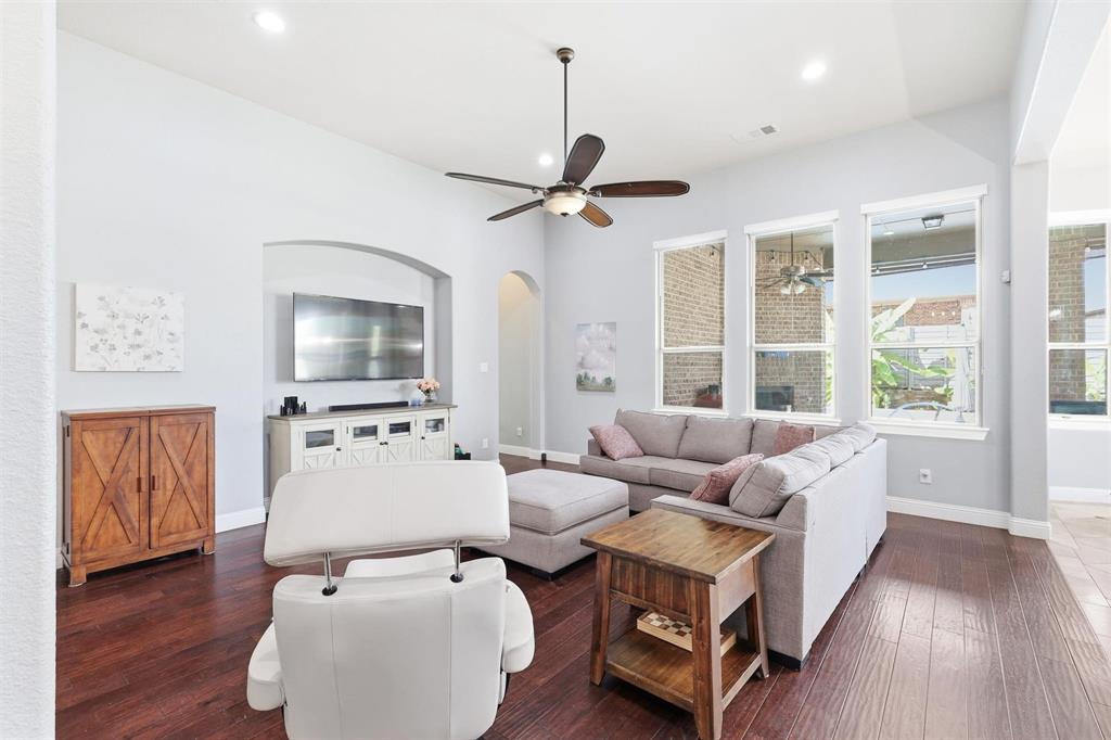 117 Birdcall Lane Argyle, TX 76226 - Photo 16 of 40 Living room with arched walkways, dark wood-type flooring, a ceiling fan, and recessed lighting