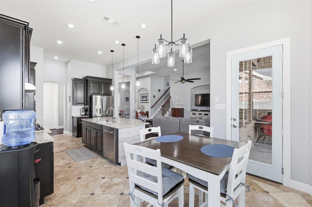 117 Birdcall Lane Argyle, TX 76226 - Photo 25 of 40 Dining room with arched walkways, a ceiling fan, stairway, and recessed lighting
