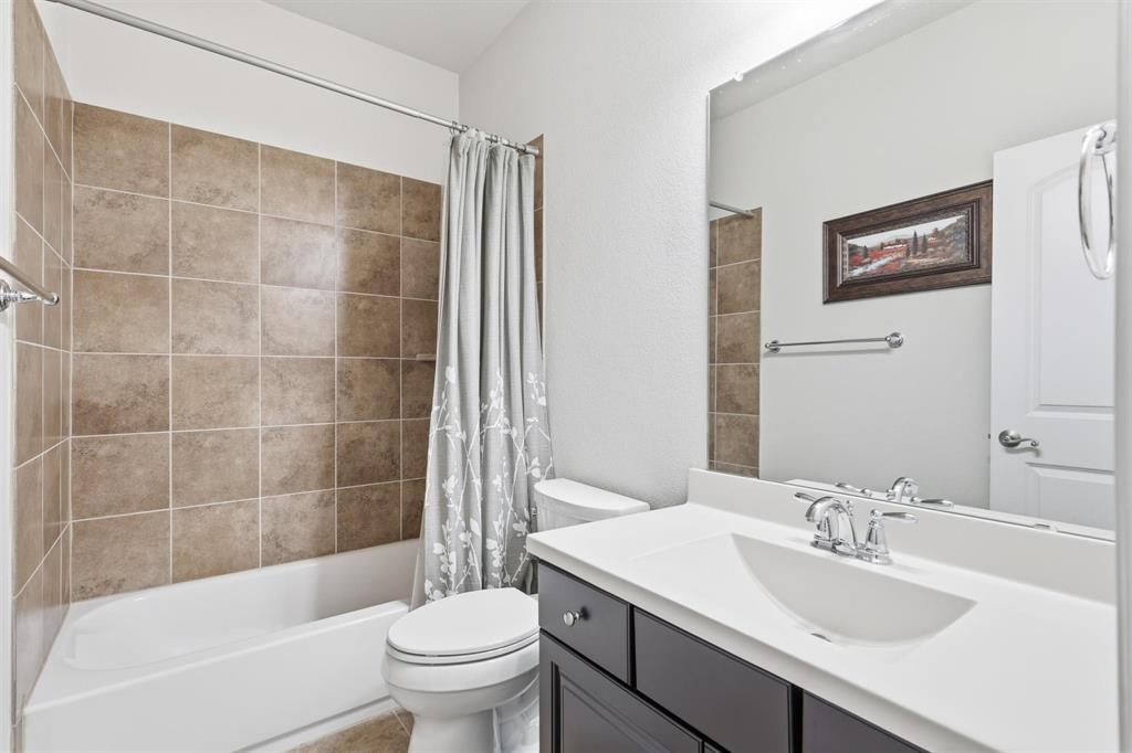 117 Birdcall Lane Argyle, TX 76226 - Photo 36 of 40 Full bathroom with shower / bath combo with shower curtain and vanity