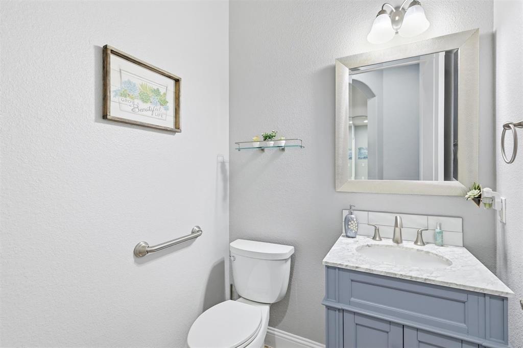 117 Birdcall Lane Argyle, TX 76226 - Photo 7 of 40 Bathroom with a textured wall and vanity