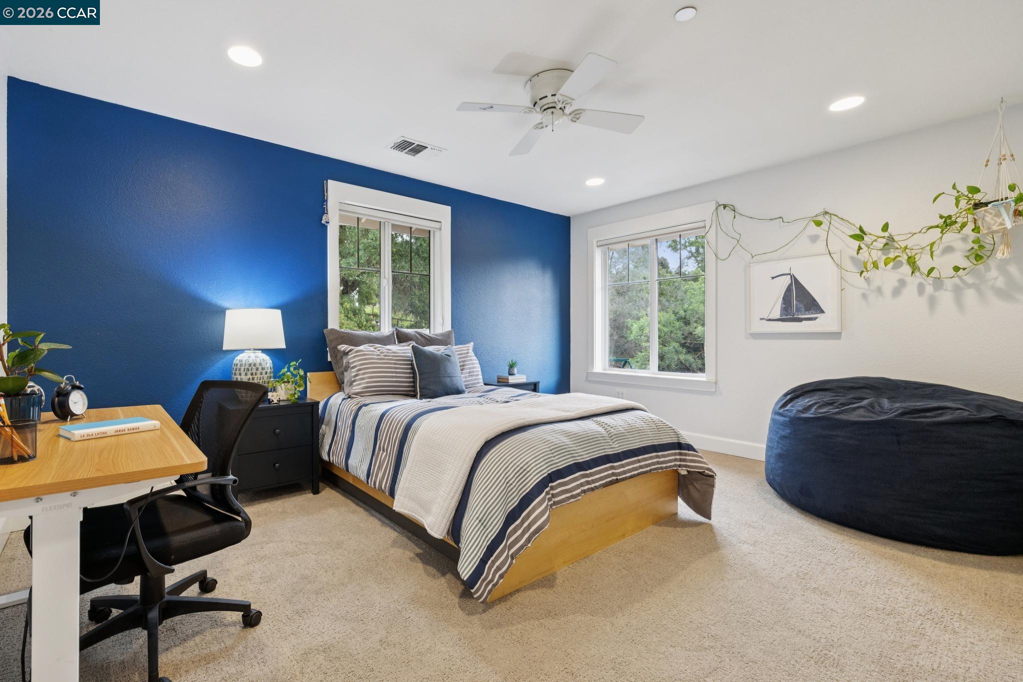 1980 Meadow Road Walnut Creek, CA 94595 - Photo 38 of 59 a bedroom with a bed and a table