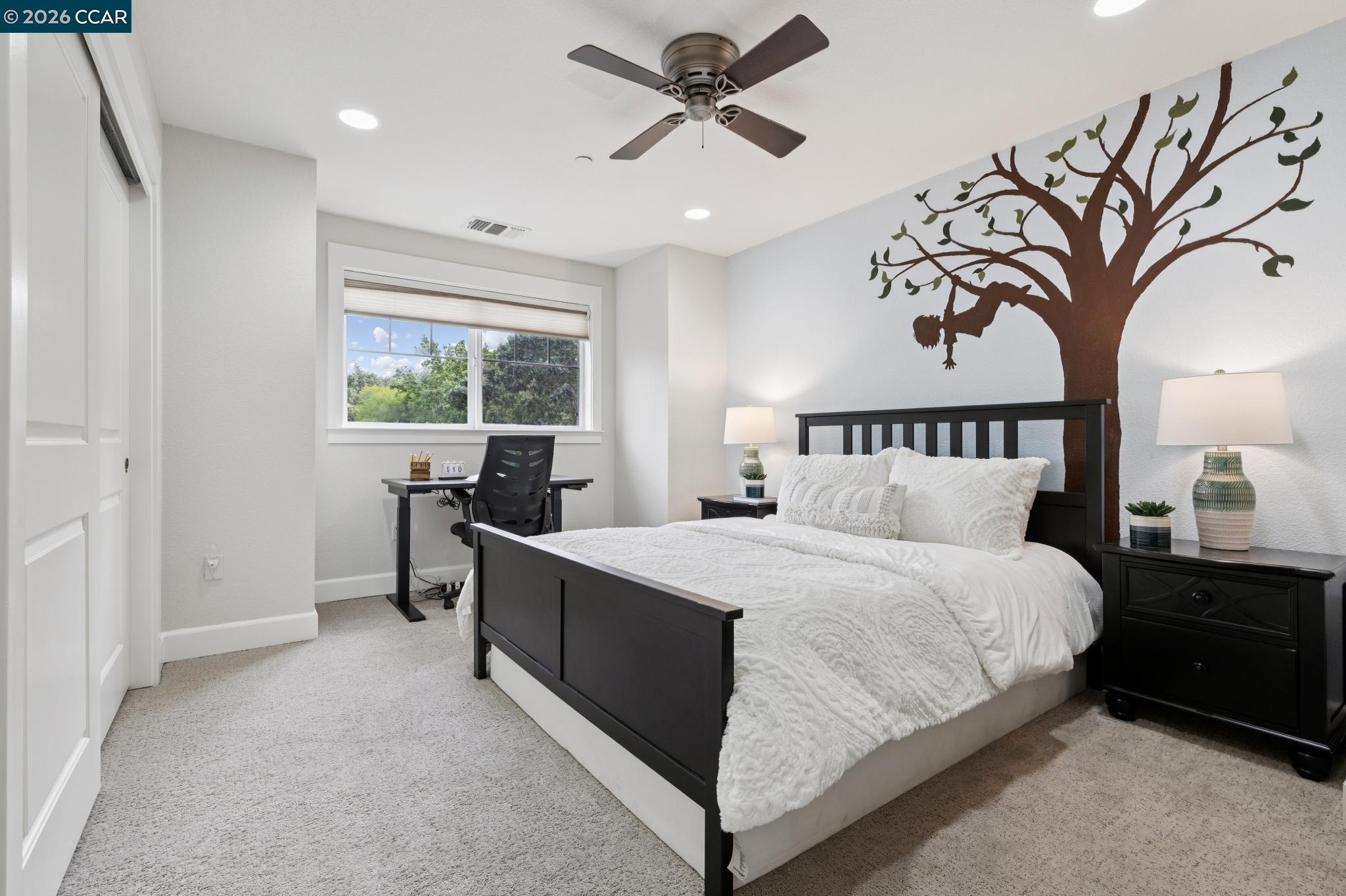 1980 Meadow Road Walnut Creek, CA 94595 - Photo 40 of 59 a bedroom with a large bed and a chandelier