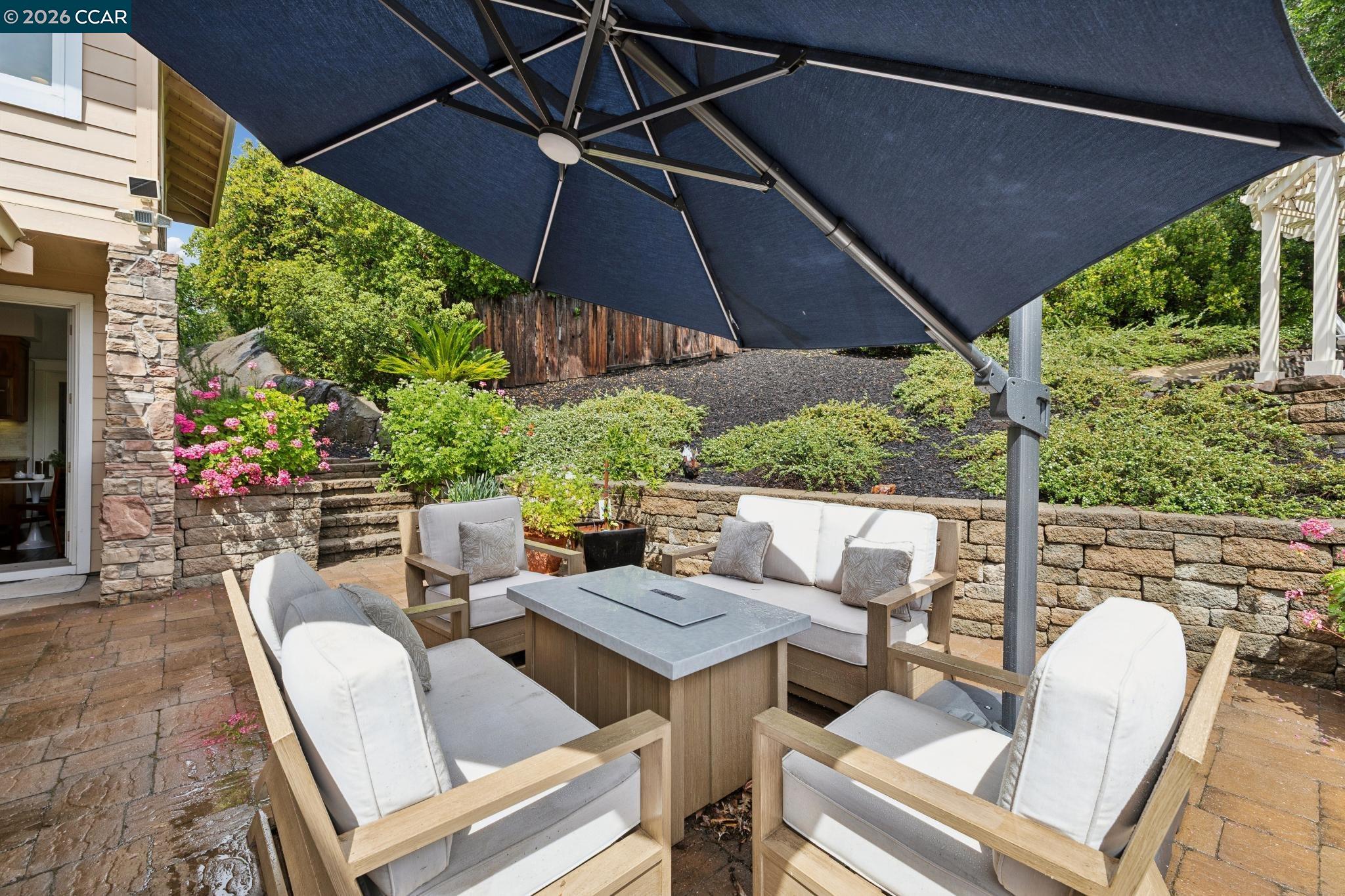 1980 Meadow Road Walnut Creek, CA 94595 - Photo 45 of 59 a patio with a patio table and chairs