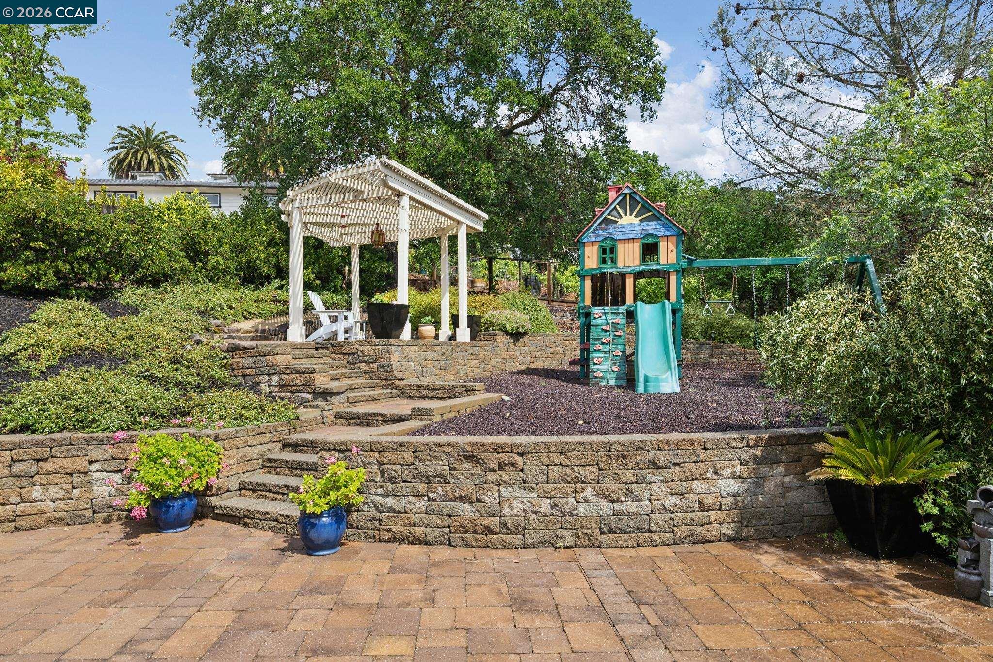 1980 Meadow Road Walnut Creek, CA 94595 - Photo 46 of 59 a front view of a house with garden
