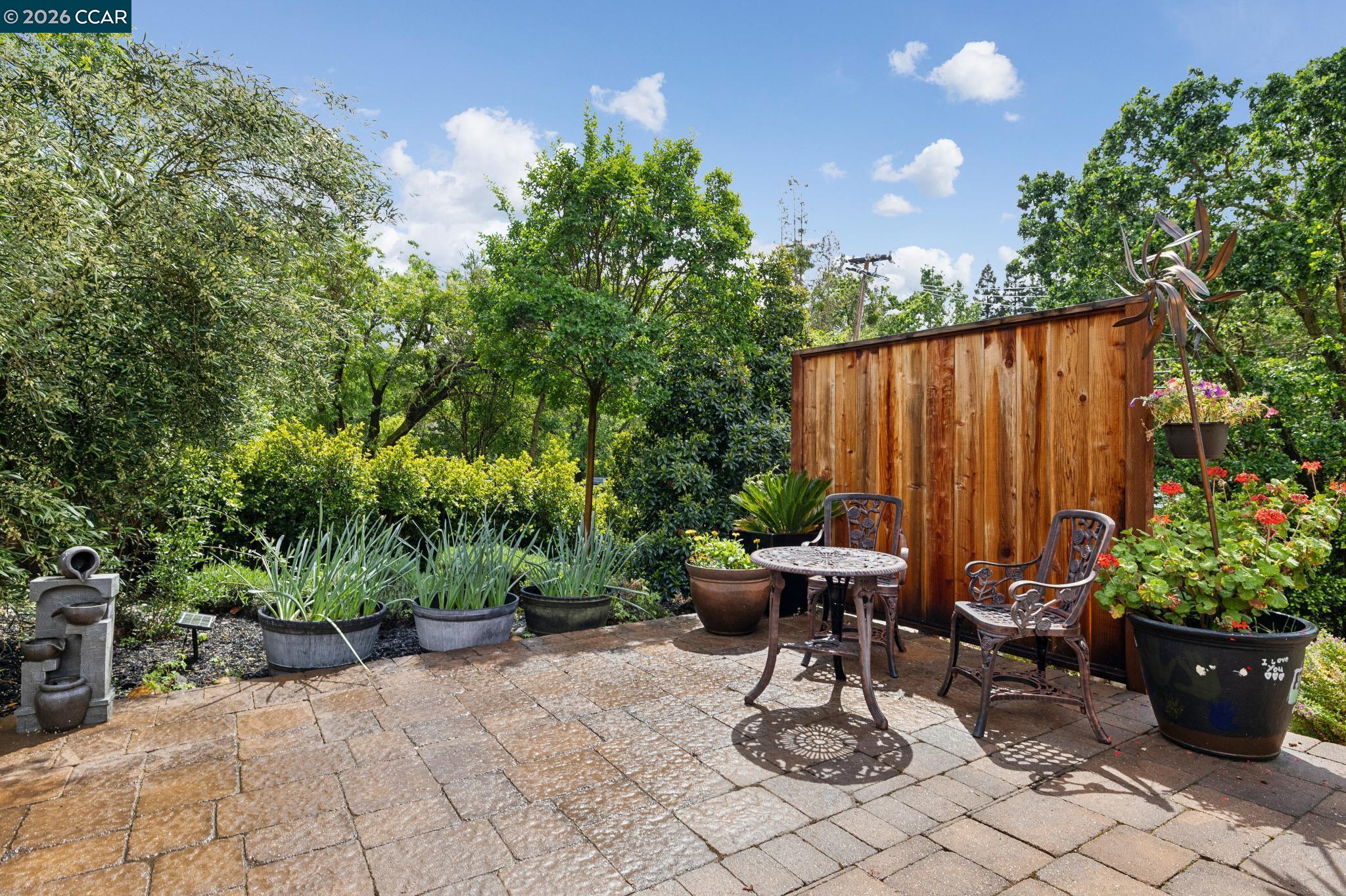 1980 Meadow Road Walnut Creek, CA 94595 - Photo 50 of 59 a view of a chair and table in backyard
