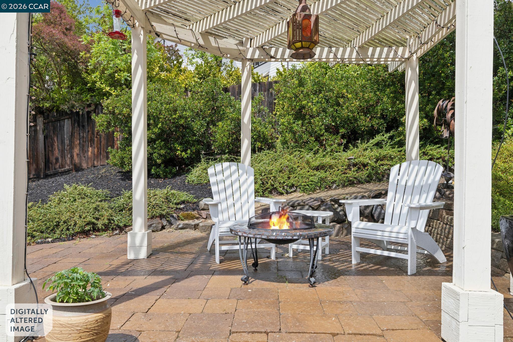 1980 Meadow Road Walnut Creek, CA 94595 - Photo 51 of 59 a view of a patio with a dining table and chairs