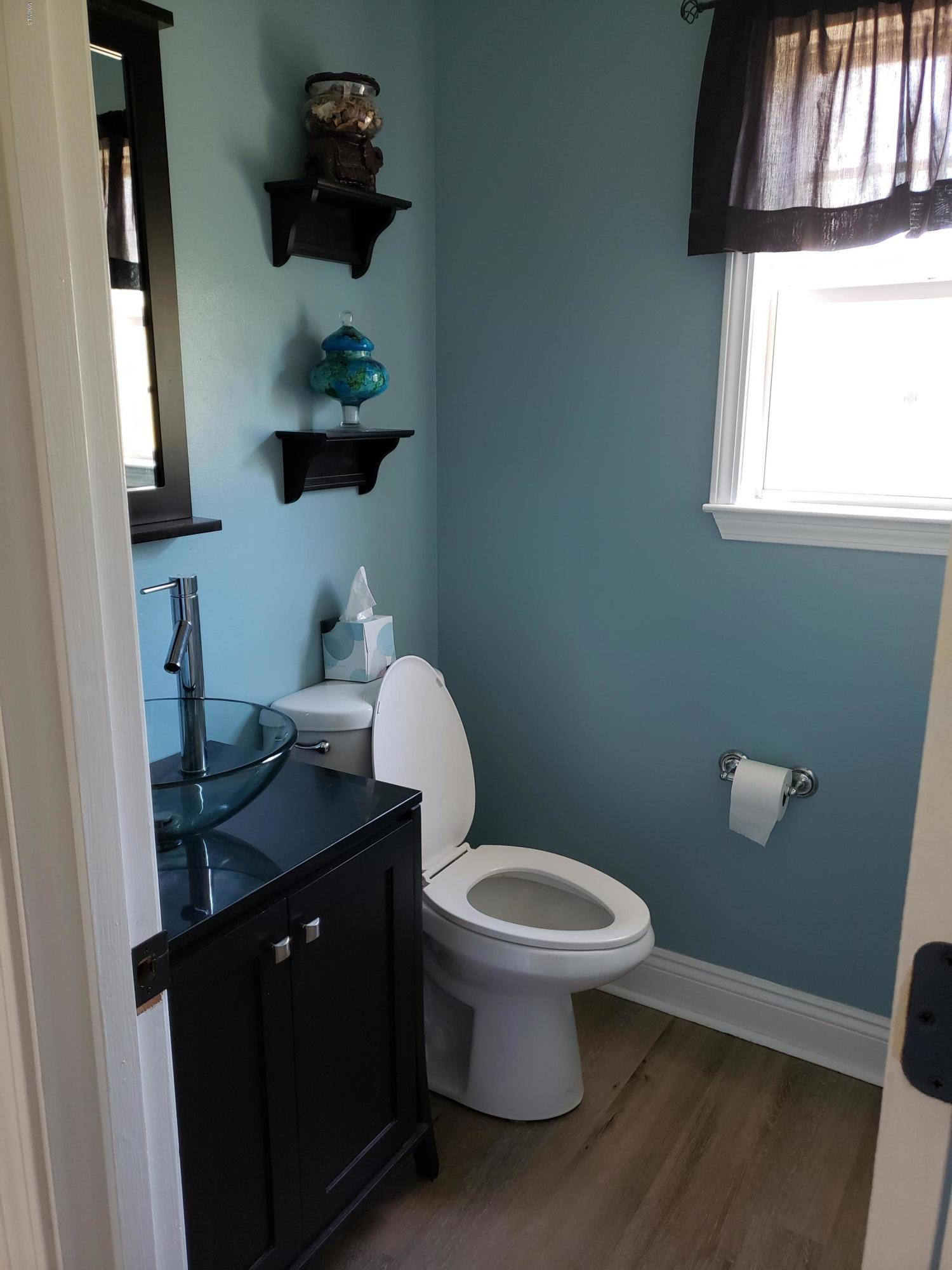 158 Rock Ranch Road Picayune, MS 39466 - Photo 17 of 34 Half Bath in hallway