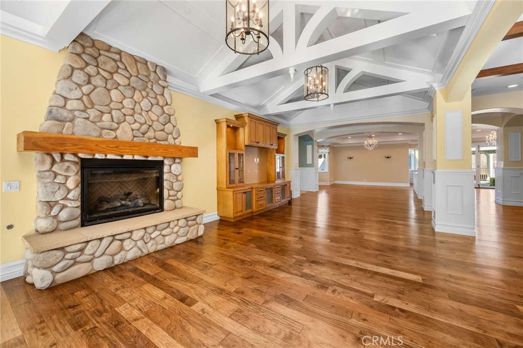 1450 North Nicky Way Orange, CA 92869 - Photo 14 of 64 a view of an empty room with wooden floor fireplace and a window